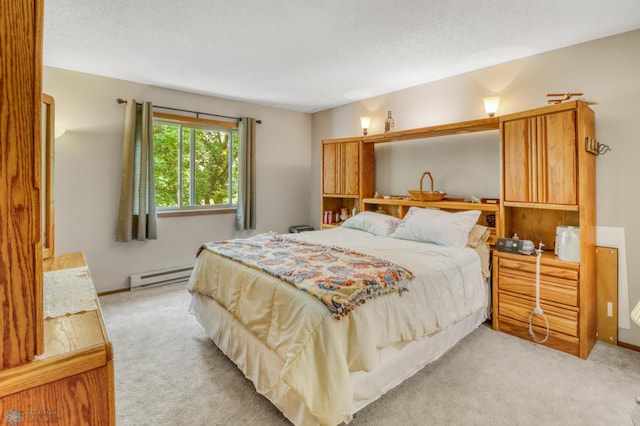 2744 32nd St S, Moorhead, MN 56560 - bedroom featuring a baseboard radiator and light colored carpet