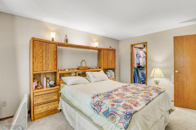 2744 32nd St S, Moorhead, MN 56560 - bedroom featuring light carpet, a walk in closet, and a closet
