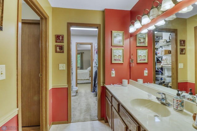 2744 32nd St S, Moorhead, MN 56560 - bathroom with vanity, ensuite bathroom, and tile patterned floors