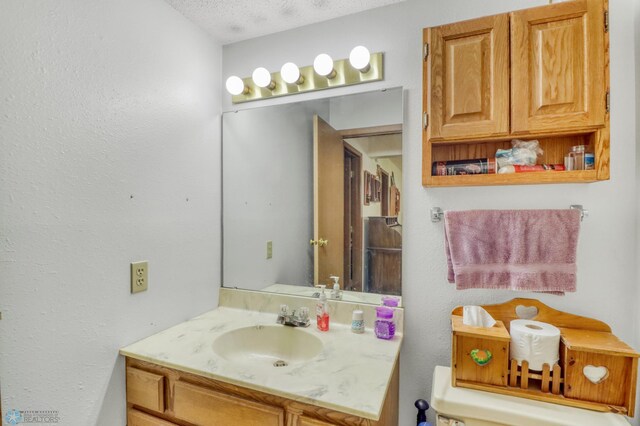 2744 32nd St S, Moorhead, MN 56560 - bathroom with vanity and a textured ceiling