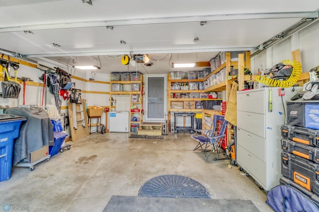 2744 32nd St S, Moorhead, MN 56560 - garage with a garage door opener and refrigerator