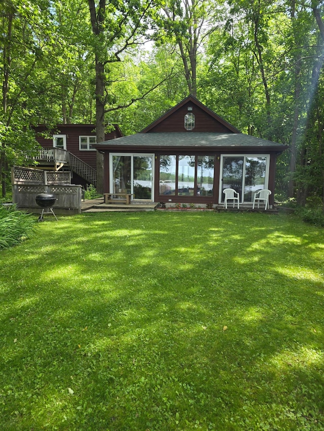 1575 120th St, Balsam Lake, WI 54810 - back of property with a lawn and a wooden deck