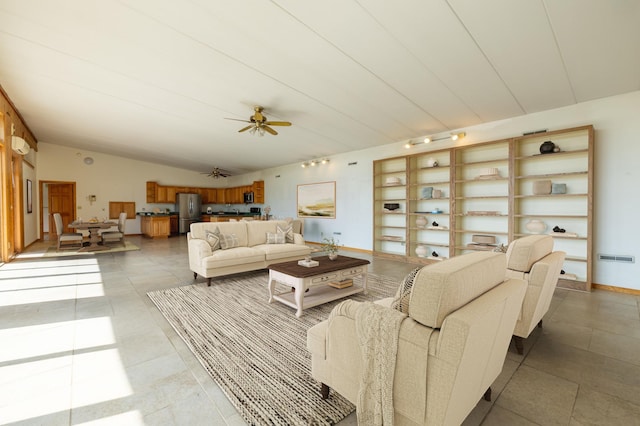 21555 699th St, Wabasha, MN 55981 - living area featuring vaulted ceiling, ceiling fan, and light tile patterned flooring