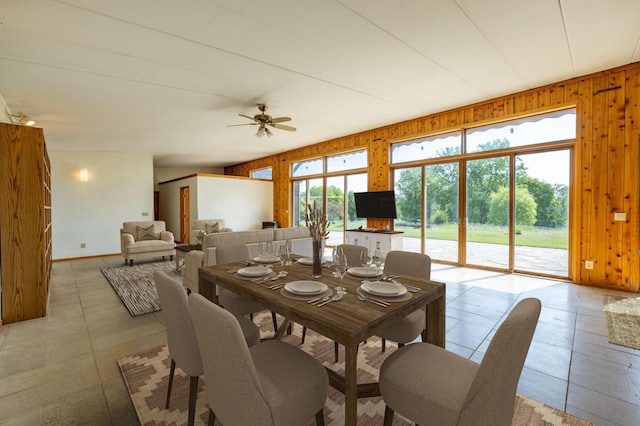21555 699th St, Wabasha, MN 55981 - dining space with wood walls and ceiling fan