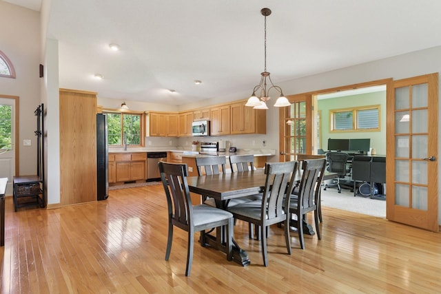 15450 Goodview Ave N, Hugo, MN 55038 - dining room featuring light wood-style floors, a desk, and a chandelier
