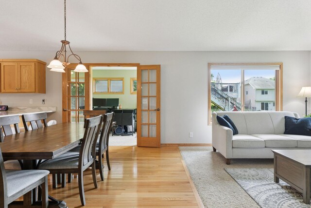 15450 Goodview Ave N, Hugo, MN 55038 - dining space with light wood finished floors and french doors