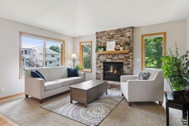 15450 Goodview Ave N, Hugo, MN 55038 - living area featuring healthy amount of natural light and a stone fireplace