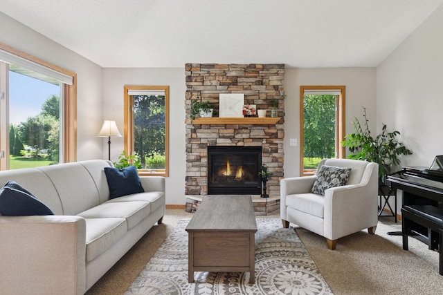 15450 Goodview Ave N, Hugo, MN 55038 - living room featuring carpet, healthy amount of natural light, and a fireplace