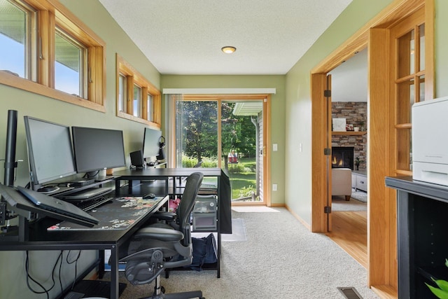 15450 Goodview Ave N, Hugo, MN 55038 - carpeted office featuring a stone fireplace
