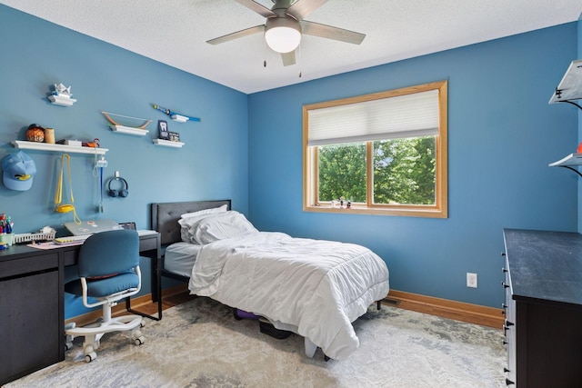 15450 Goodview Ave N, Hugo, MN 55038 - bedroom with wood finished floors, a desk, a ceiling fan, and a textured ceiling