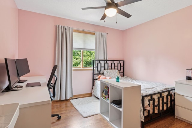 15450 Goodview Ave N, Hugo, MN 55038 - bedroom featuring a desk, wood finished floors, and ceiling fan