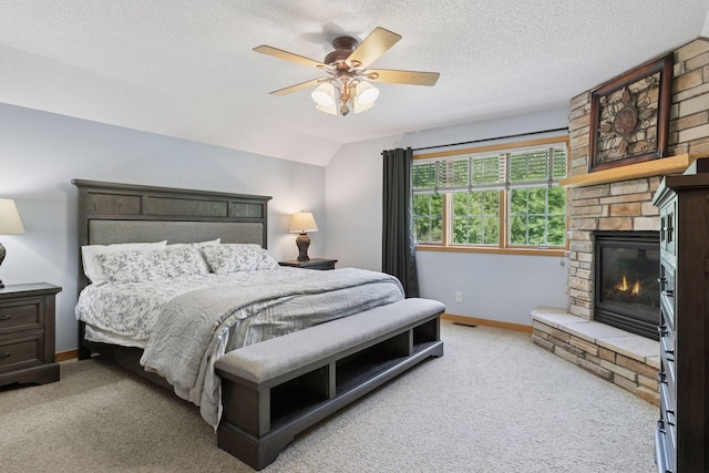 15450 Goodview Ave N, Hugo, MN 55038 - carpeted bedroom with a fireplace, ceiling fan, a textured ceiling, and vaulted ceiling