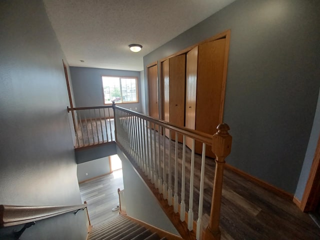 21196 Morgan Dr, Forest Lake, MN 55025 - stairway featuring wood finished floors and baseboards