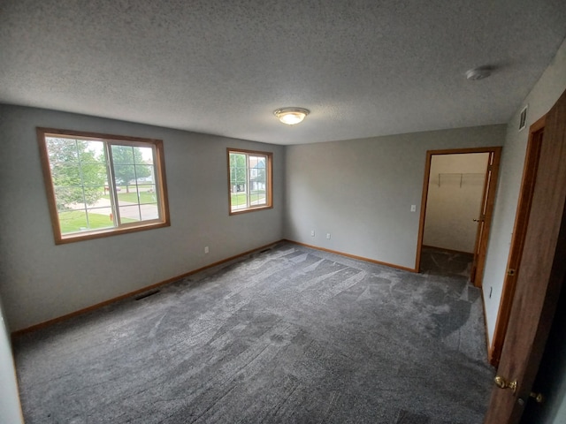 21196 Morgan Dr, Forest Lake, MN 55025 - carpeted empty room featuring a textured ceiling and a smoke detector