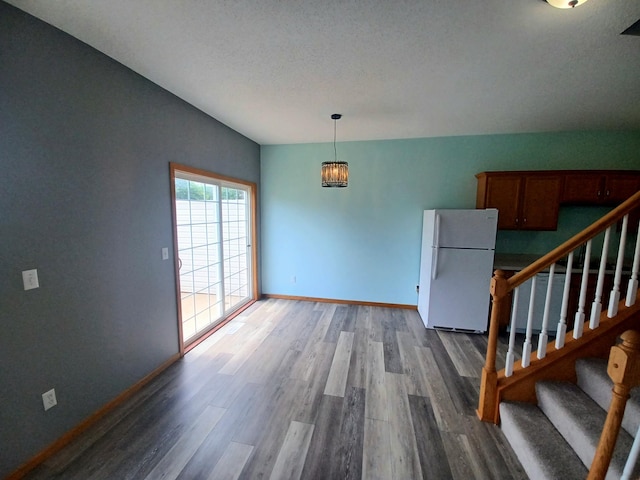 21196 Morgan Dr, Forest Lake, MN 55025 - spare room with wood finished floors and stairs