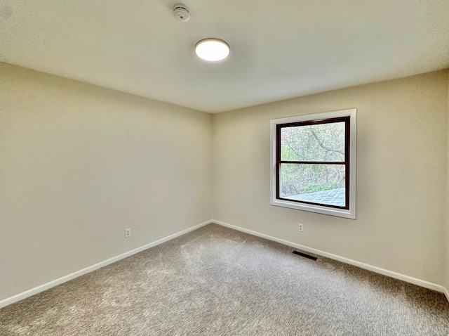 809 Wagon Wheel Trl, Mendota Heights, MN 55120 - carpeted spare room featuring a smoke detector and baseboards