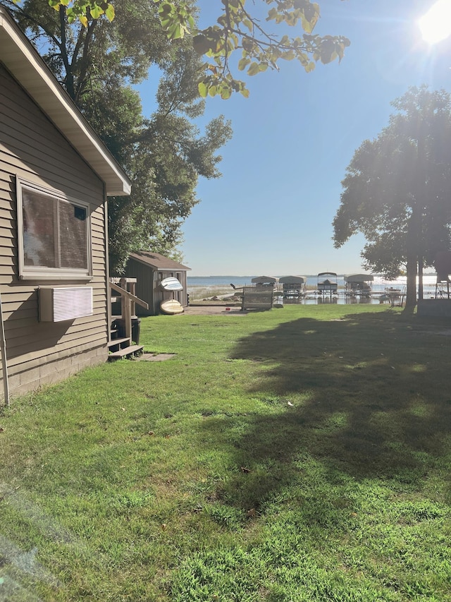 35686 Rush Lake Loop Unit 8, Ottertail, MN 56571 - view of yard featuring a water view and a shed