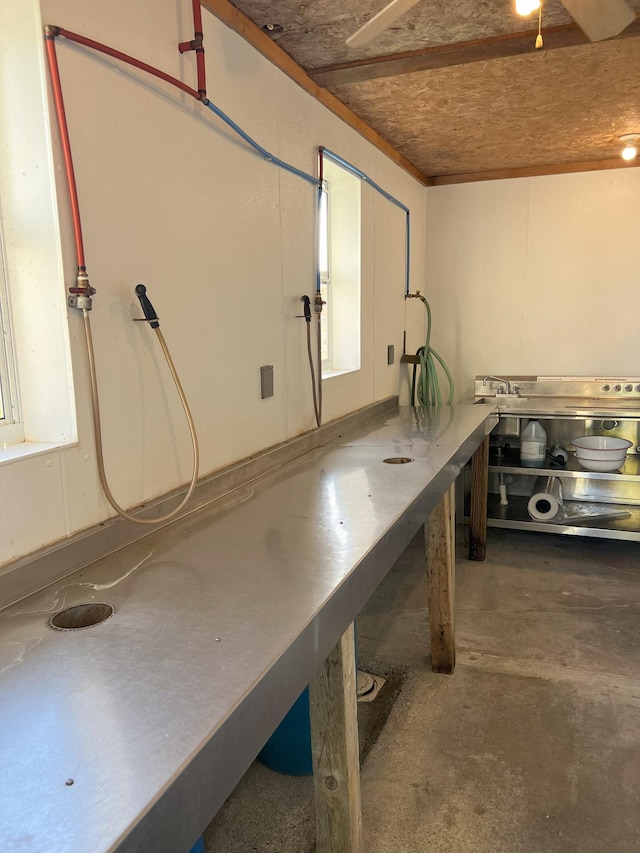 35686 Rush Lake Loop Unit 8, Ottertail, MN 56571 - miscellaneous room featuring unfinished concrete floors and a workshop area