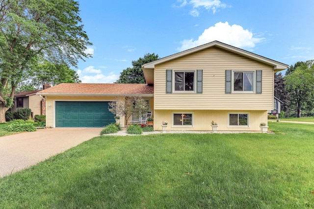 2261 Clark St, Eagan, MN 55122 - tri-level home with a garage, concrete driveway, a front yard, and a chimney