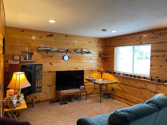 640 Meadowlark Ln, Eden Valley, MN 55329 - living area with carpet flooring, wooden walls, a textured ceiling, and recessed lighting