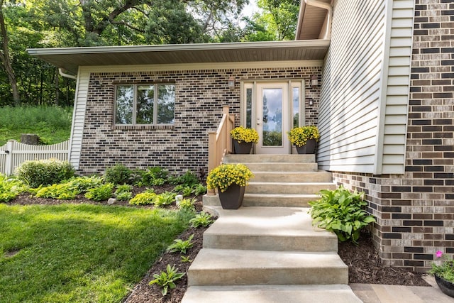 6317 Oak Meadow Ln NW, Rochester, MN 55901 - view of exterior entry featuring brick siding