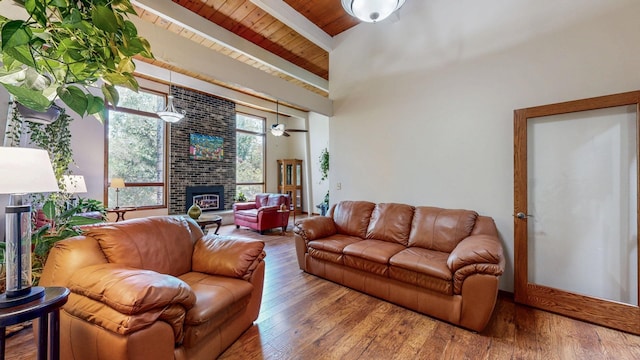 6317 Oak Meadow Ln NW, Rochester, MN 55901 - living area with a wood ceiling with exposed beams, a fireplace, and wood finished floors