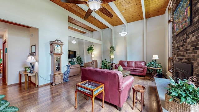 6317 Oak Meadow Ln NW, Rochester, MN 55901 - living area with hardwood / wood-style floors, ceiling fan, a wooden ceiling with exposed beams, and a glass covered fireplace