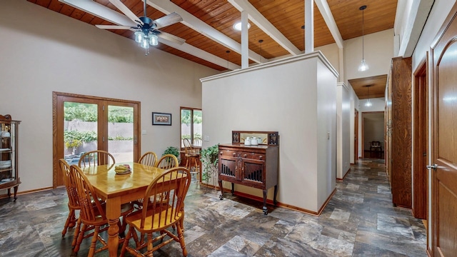 6317 Oak Meadow Ln NW, Rochester, MN 55901 - dining area featuring a wooden ceiling with exposed beams, dark stone finish floors, a ceiling fan, and a towering ceiling