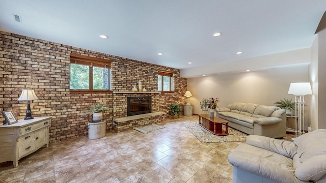 6317 Oak Meadow Ln NW, Rochester, MN 55901 - living room with brick wall, recessed lighting, and a fireplace