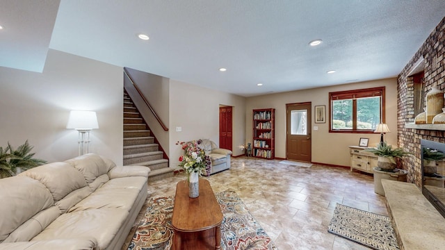 6317 Oak Meadow Ln NW, Rochester, MN 55901 - living area with a brick fireplace, stairway, and recessed lighting