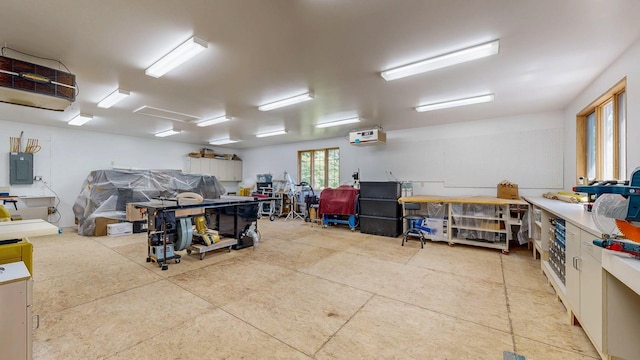 6317 Oak Meadow Ln NW, Rochester, MN 55901 - garage featuring electric panel, a workshop area, and a heating unit