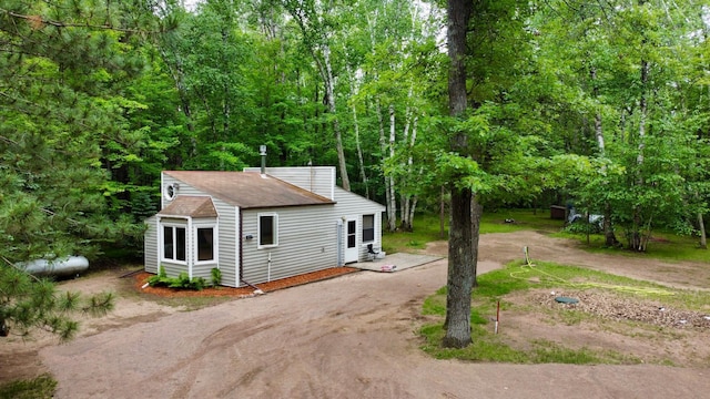 87102 Alder Loop, Sturgeon Lake, MN 55783 - view of front facade with driveway and a shingled roof