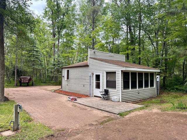 87102 Alder Loop, Sturgeon Lake, MN 55783 - exterior space featuring a shingled roof and a patio