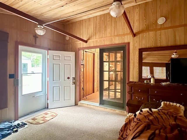 87102 Alder Loop, Sturgeon Lake, MN 55783 - carpeted entryway with wooden ceiling, wooden walls, and lofted ceiling
