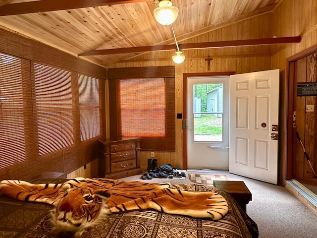 87102 Alder Loop, Sturgeon Lake, MN 55783 - carpeted bedroom featuring lofted ceiling, wood walls, and wooden ceiling