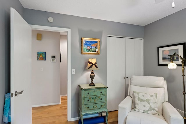 8447 Morgan Ln, Eden Prairie, MN 55347 - sitting room featuring wood finished floors and baseboards