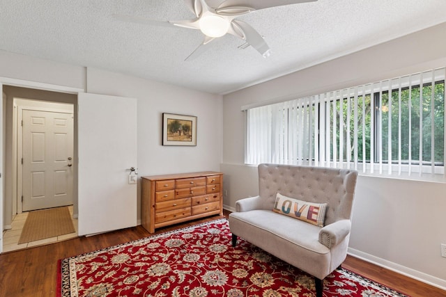 8447 Morgan Ln, Eden Prairie, MN 55347 - sitting room featuring wood finished floors, a ceiling fan, and a textured ceiling