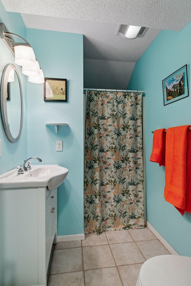 8447 Morgan Ln, Eden Prairie, MN 55347 - bathroom with vanity, a textured ceiling, curtained shower, and tile patterned flooring