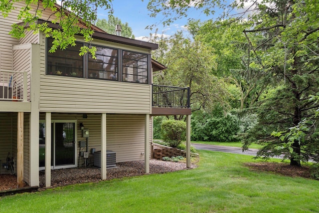 8447 Morgan Ln, Eden Prairie, MN 55347 - view of side of property featuring a yard and a sunroom