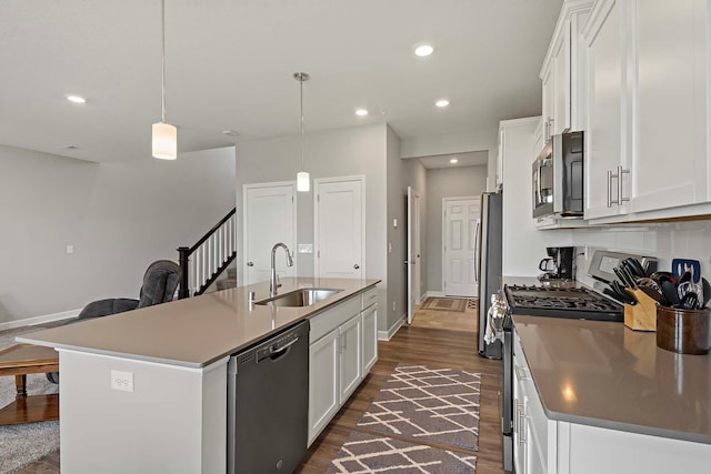 14145 Aberdeen Way, Rosemount, MN 55068 - kitchen with stainless steel appliances, an island with sink, dark wood finished floors, white cabinetry, and recessed lighting