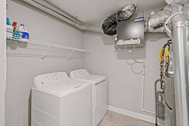 14145 Aberdeen Way, Rosemount, MN 55068 - laundry area with independent washer and dryer and light tile patterned floors