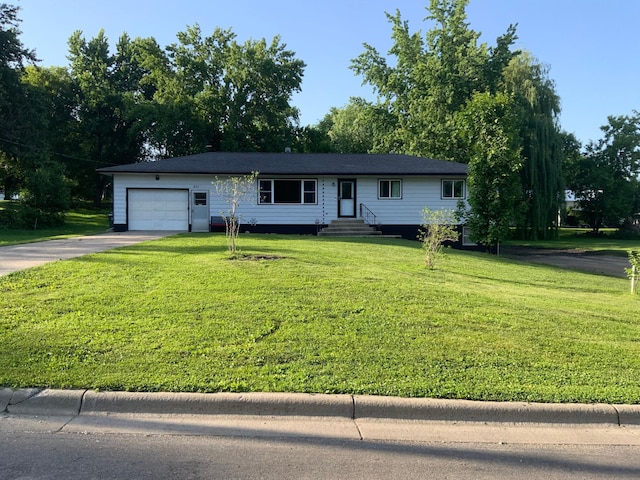 511 2nd St S, Watkins, MN 55389 - ranch-style house with driveway, a garage, a front lawn, and entry steps