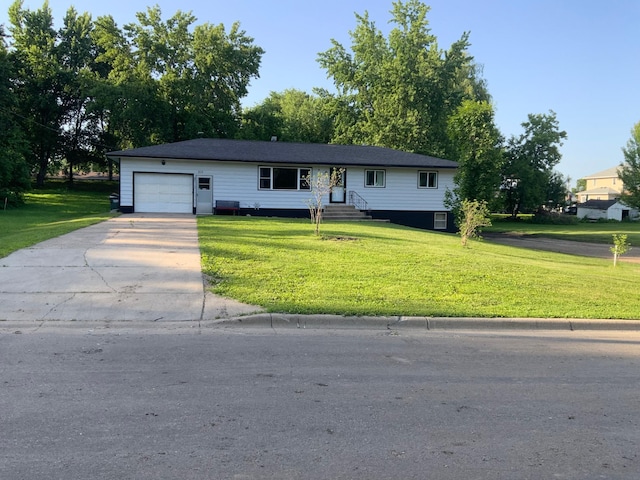 511 2nd St S, Watkins, MN 55389 - view of front of house with an attached garage, a front yard, and concrete driveway