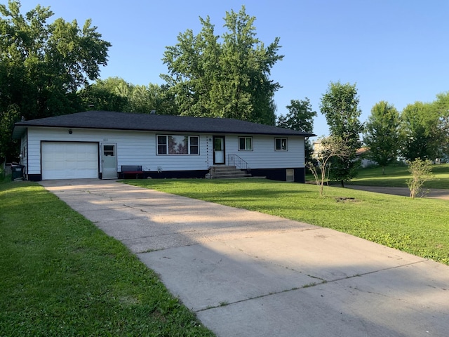 511 2nd St S, Watkins, MN 55389 - single story home with an attached garage, driveway, and a front lawn