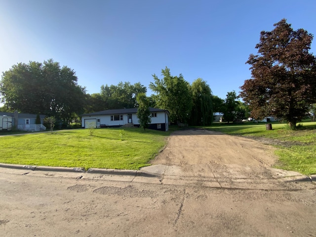 511 2nd St S, Watkins, MN 55389 - single story home featuring driveway, a front yard, and an attached garage