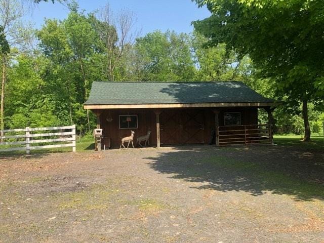 1757 325th Ave, West Sweden Twp, WI 54837 - view of outbuilding with an exterior structure, dirt driveway, and a carport