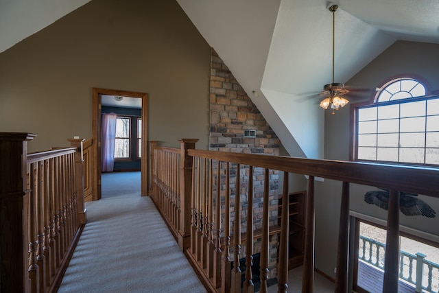 1757 325th Ave, West Sweden Twp, WI 54837 - hallway featuring high vaulted ceiling, an upstairs landing, and carpet flooring