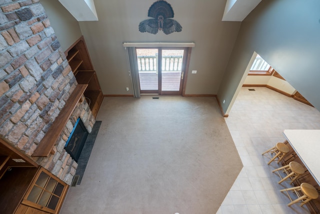 1757 325th Ave, West Sweden Twp, WI 54837 - unfurnished living room featuring a fireplace and a high ceiling