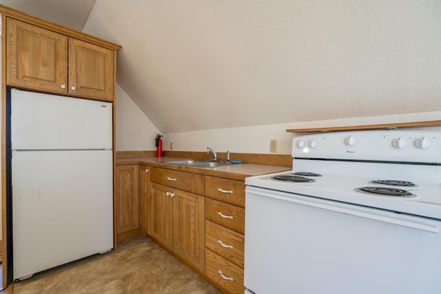 1757 325th Ave, West Sweden Twp, WI 54837 - kitchen with white appliances, brown cabinetry, lofted ceiling, and light countertops