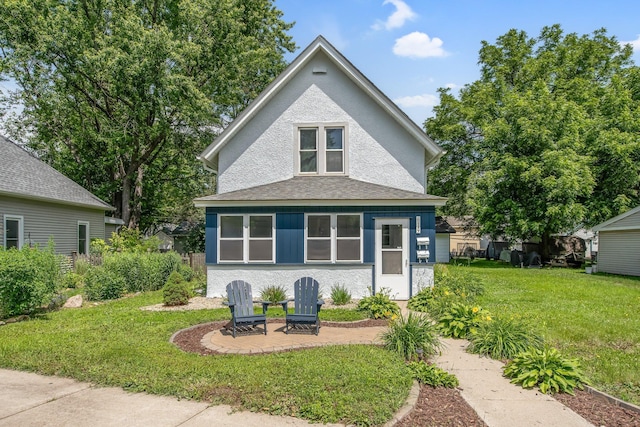 619 4th Ave E, Shakopee, MN 55379 - view of front of home with a front yard and stucco siding